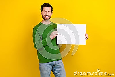 Photo of attractive wear green sweater stand demonstration protest show empty space white placard isolated on yellow Stock Photo