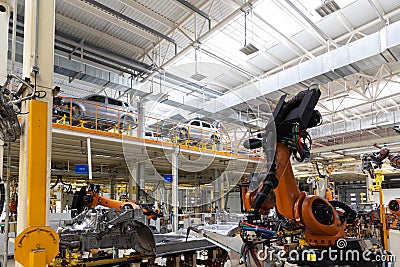Photo of automobile production line. Modern car assembly plant. Auto industry. Interior of a high-tech factory, modern Editorial Stock Photo