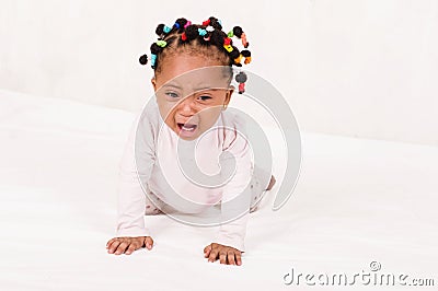 Photo of baby creeping towards her mother crying Stock Photo