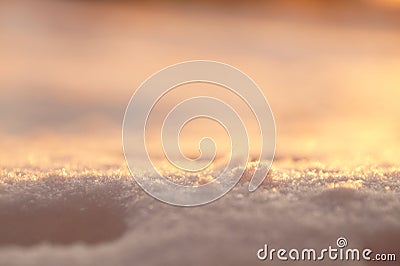 Photo background, macro snow in sunset light. Blurred golden and Stock Photo