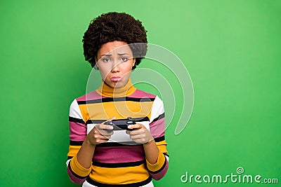 Photo of bad mood dark skin wavy lady playing video games joystick hands loser awful player crying sorrow wear casual Stock Photo