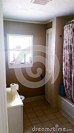 Before Photo of a Bathroom in Need of a Total Gut Job to Modernize It Stock Photo