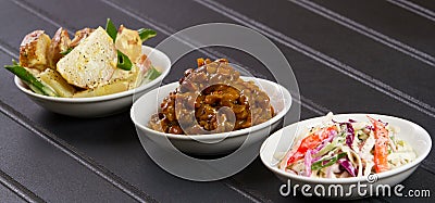 BBQ Side Dishes on Black Table Stock Photo