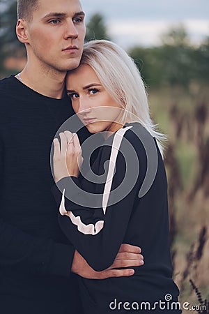 Beautiful blonde girl with boyfriend Stock Photo