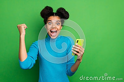 Photo of beautiful crazy dark skin lady hold telephone watch likes comments reaction followers subscribers raise fist Stock Photo