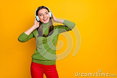 Photo of beautiful lady holding hands on ears vacation time listen youth music looking side empty space wear cool Stock Photo