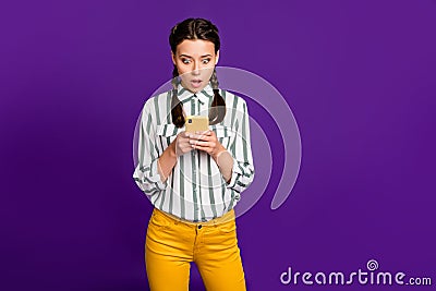 Photo of beautiful lady holding telephone open mouth reading fake news negative comments wear striped shirt yellow Stock Photo