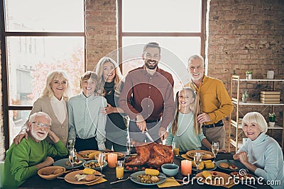 Photo of big family standing hugging feast table holiday roasted turkey making traditional portrait eight relatives Stock Photo