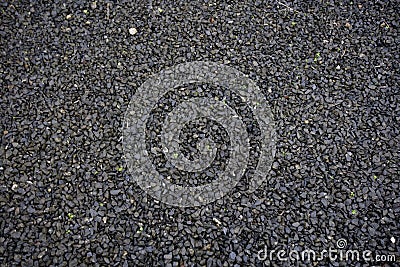 Photo of Black wet gravel Stock Photo