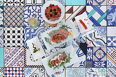 Photo of brunch / lunch / breakfast displayed on colorful tiles Stock Photo