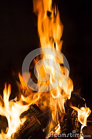 Burning and glowing pieces of wood in Fireplace Stock Photo