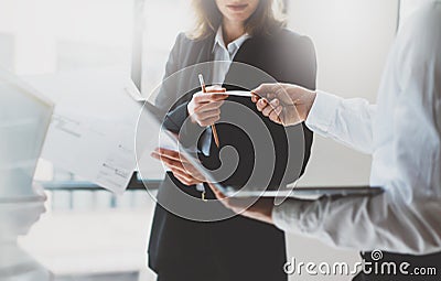 Photo business partners meeting. Team work. Business woman giving card colleague. Presentation new project modern office Stock Photo