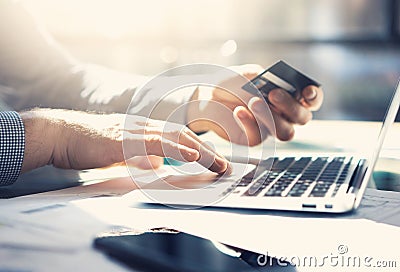 Photo businessman working with generic design notebook. Online payments, banking, hands keyboard. Blurred background Stock Photo