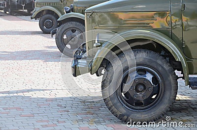 Photo of the cabins of three military off-road vehicles from the times of the Soviet Union. Side view of military cars from the f Stock Photo