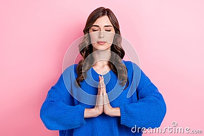 Photo of calm peaceful focused girl wear blue comfort clothes two arm together pray for peace isolated on pink color Stock Photo