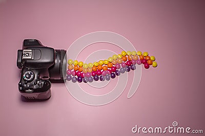 Photo camera and multi-colored candies skills, concept photo Stock Photo