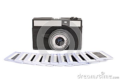 Photo camera with spun film and diapositive slides Stock Photo