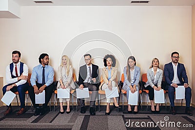 Photo of candidates waiting for a job interview. Stock Photo