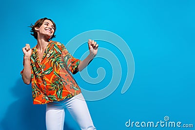 Photo of carefree girl wear stylish nice outfit dancing looking empty space seasonal special cool offer isolated on blue Stock Photo