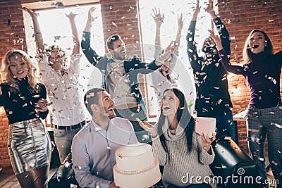 Photo of celebrating best friends arranging unexpected surprise baby party future parents sit sofa hold big cake Stock Photo