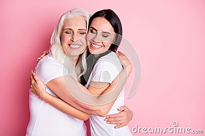 Photo of charming aged mother young daughter two ladies generation hug cozy best friends finally together wear casual Stock Photo