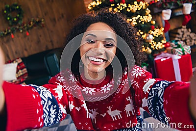 Photo of charming cute girl making selfie shooting cozy decorated illuminated room indoors magic dream season Stock Photo