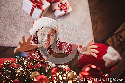 Photo of charming cute school girl wear print pullover headwear smiling hanging new year balls indoors house home room Stock Photo