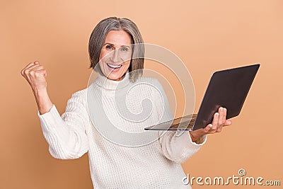 Photo of charming excited lady dressed white sweater getting twitter telegram facebook message isolated beige color Stock Photo