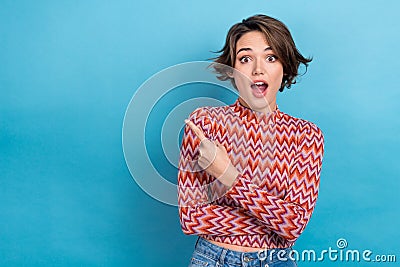 Photo charming funny lady indicate finger empty space shopping center sale off wear print shirt isolated blue color Stock Photo