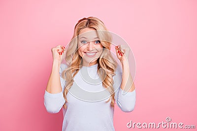 Photo of charming lucky lady dressed blue shirt smiling rising arms empty space isolated pink color background Stock Photo