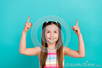 Photo of charming school girl direct fingers up empty space ad ads adv wear striped summer dress isolated cyan color Stock Photo