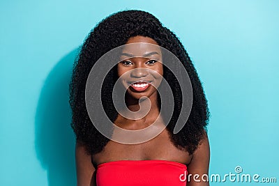 Photo of charming shiny dark skin lady wear red crop top smiling isolated blue color background Stock Photo