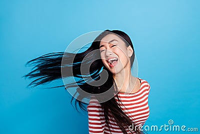 Photo of charming shiny lady dressed red shirt dancing wind blowing isolated blue color background Stock Photo