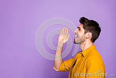 Photo of cheerful confident side profile handsome unshaven man screaming into empty space to announce upcoming event Stock Photo