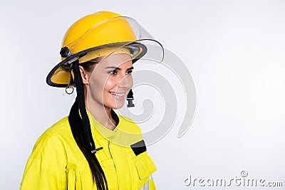 Photo of cheerful good mood young firewoman dressed yellow uniform helmet smiling isolated white color background Stock Photo