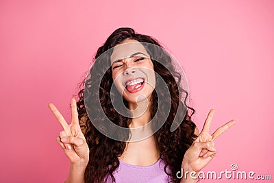 Photo of cheerful optimistic carefree girl showing you double v-sign with tongue out while isolated with pastel Stock Photo