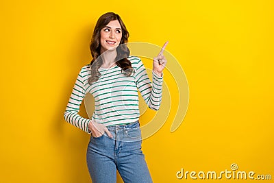 Photo of cheerful satisfied pretty woman striped shirt with jeans direct finger look empty space ad empty space isolated Stock Photo