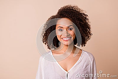 Photo of cheerful stunning lady toothy beaming smile nice curly hairstyle isolated on beige color background Stock Photo