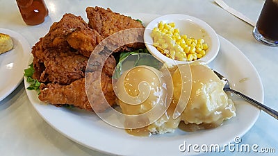 Photo Of Chicken Dinner With Corn And Mashed Potatoes Stock Photo