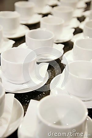 Photo closely standing diagonal rows together 16 white porcelain mugs Stock Photo