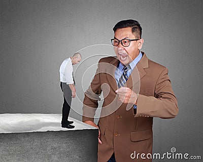 Angry Boss Screaming at His Worker Stock Photo