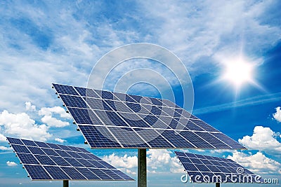 Photo collage of solar panels against blue sky background Stock Photo