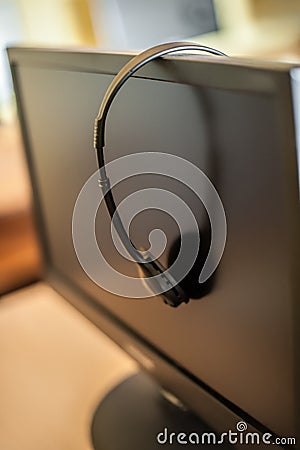 Photo of computers with headphones on desk in primary school Stock Photo