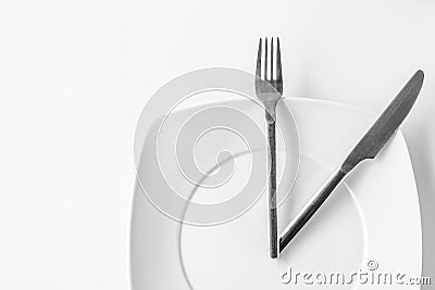 Conceptual time to eat isolated on White Stock Photo