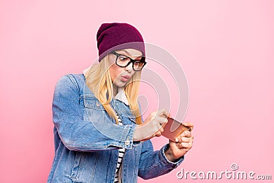 Photo of confused nice cute lady having deepened into world of phone games and loosing there while isolated with pink Stock Photo