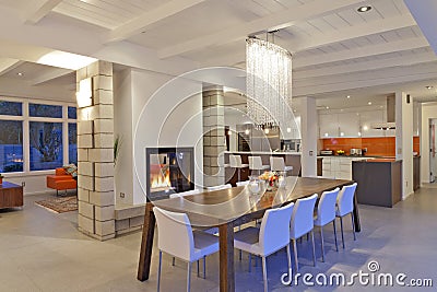 Contemporary chandelier in modern dining room of luxurious villa Stock Photo