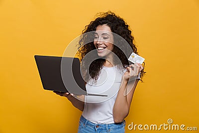 Photo of content woman 20s wearing casual clothes holding black Stock Photo