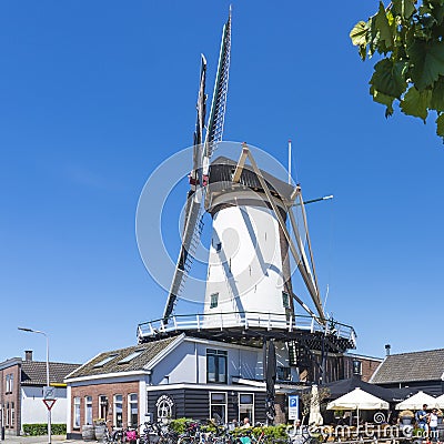 Photo of Corn-mill de Arkduif along the Oude Rijn in Bodegraven, the Netherlands Editorial Stock Photo