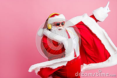 Photo crazy funky cool bearded santa claus enjoy listen headphone stereo x-mas christmas music dance raise finger wear Stock Photo