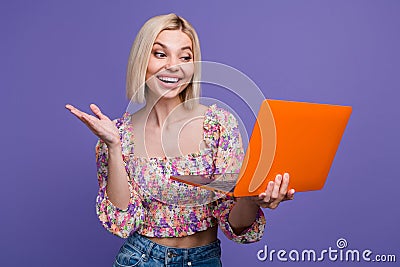 Photo of cute excited lady wear flower print top reading twitter telegram facebook mails isolated violet color Stock Photo